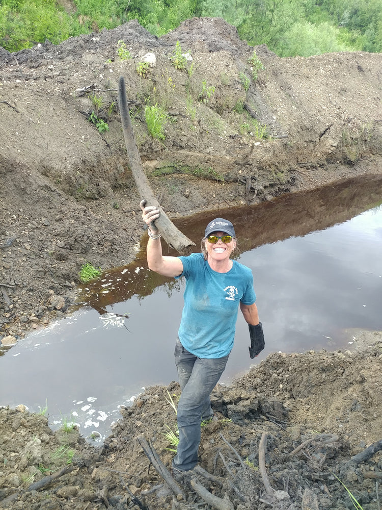 Kristin Reeves Park always happy finding a broken mammoth tusk at the Boneyard Alaska, Fairbanks Gold Company.