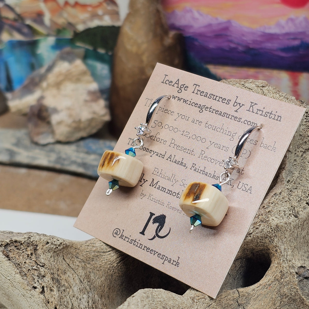 Angled view of Woolly Mammoth fossil ivory earrings showing polished beads and Swarovski Aurora crystals, crafted by Kristin R Park at Ice Age Treasures.