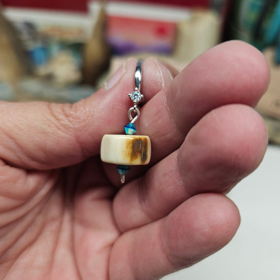 Woolly Mammoth fossil ivory earrings showing polished beads and Swarovski Aurora crystals, crafted by Kristin R Park at Ice Age Treasures.
