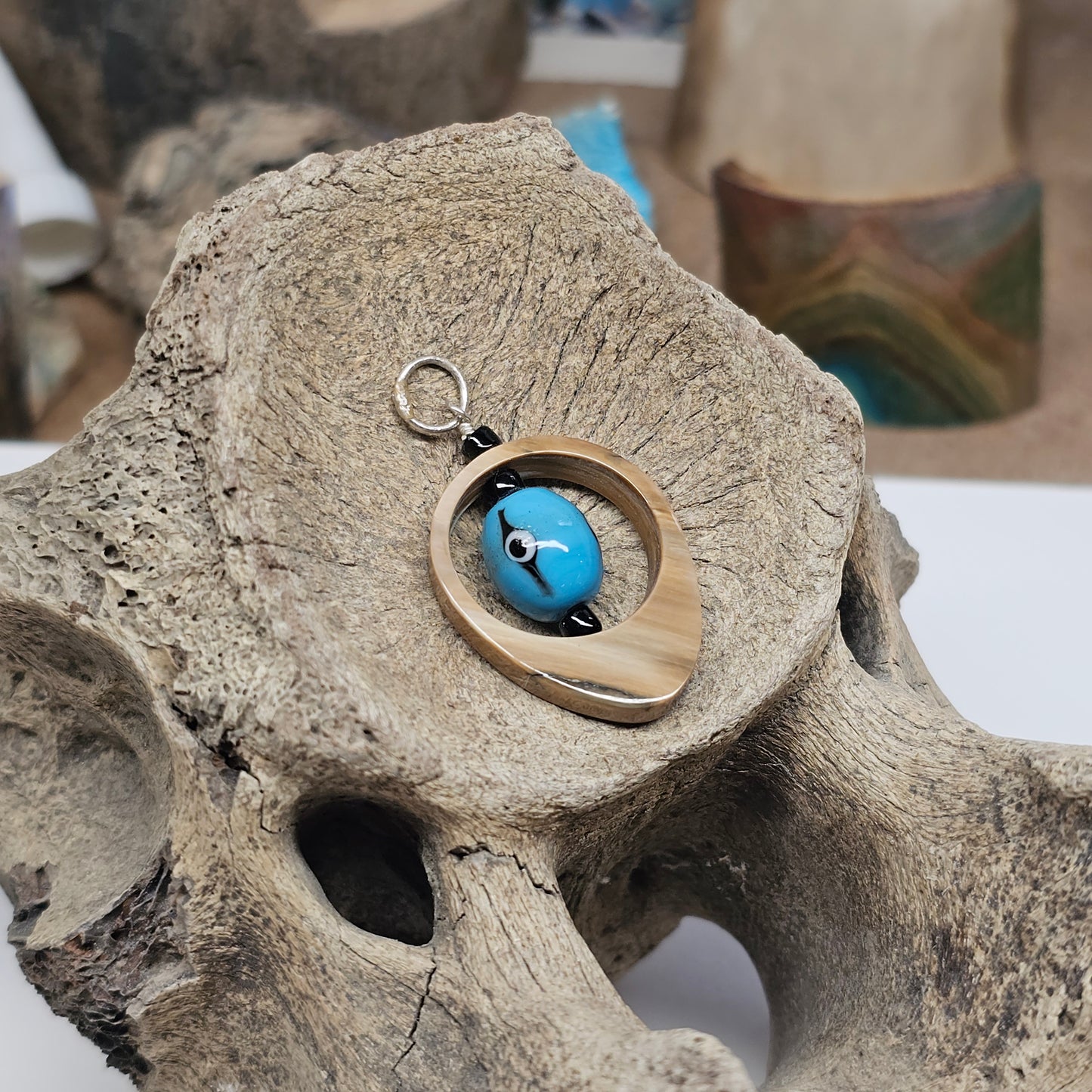 Close-up of Boneyard Alaska fossil ivory grain and mineralization on Third Eye Pendant by Ice Age Treasures