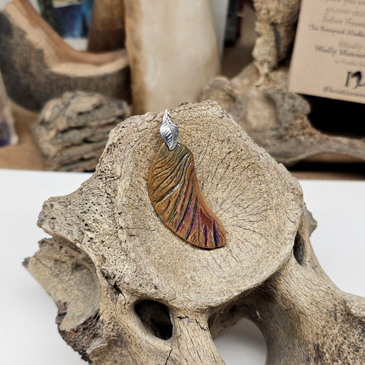 Woolly Mammoth fossil ivory angel wing pendant hand carved by Kristin at Ice Age Treasures using Boneyard Alaska materials — Unbroken Wing