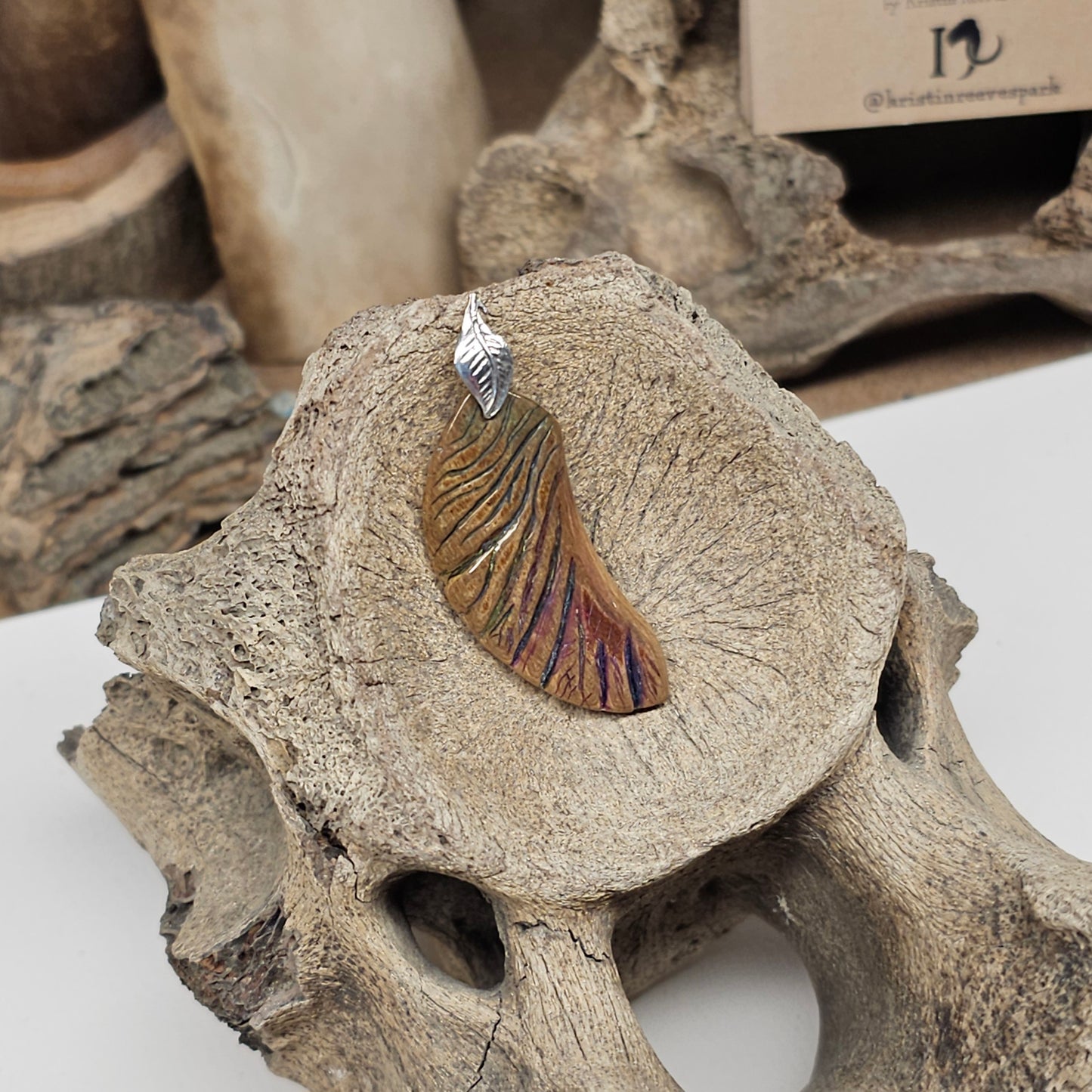 Sterling silver leaf accent on Woolly Mammoth fossil ivory angel wing pendant — Boneyard Alaska fossil ivory, crafted by Kristin at Ice Age Treasures