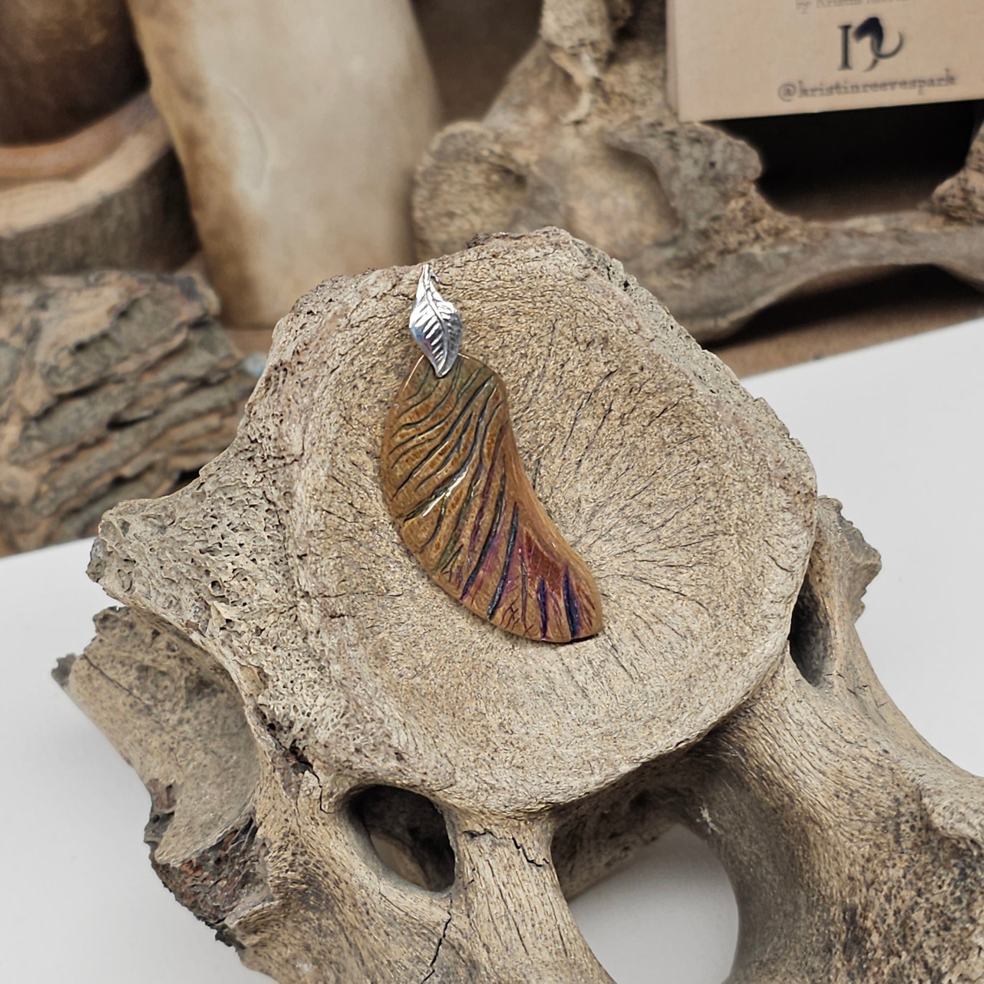 Sterling silver leaf accent on Woolly Mammoth fossil ivory angel wing pendant — Boneyard Alaska fossil ivory, crafted by Kristin at Ice Age Treasures