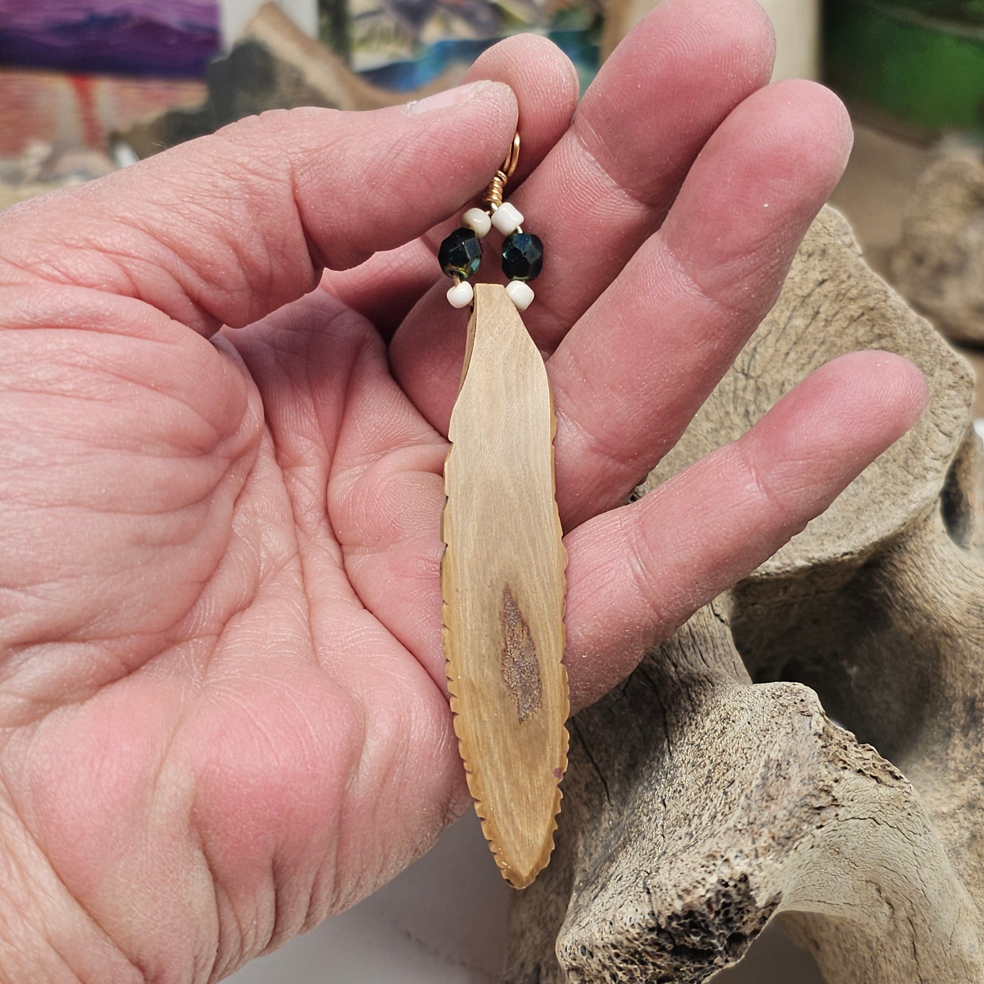 Rear view Woolly Mammoth tusk ivory feather pendant — permafrost mineral staining and tusk bark character, handmade by IceA ge Treasures
